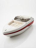 Speedboat-shaped plush dog bed, white with red and black stripe